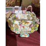 A 19th century porcelain basket, gilded, painted and applied with fruit and flowers. 9" wide.