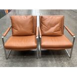 A pair of Camerich of London contemporary style tan leather and steel armchairs.