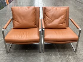 A pair of Camerich of London contemporary style tan leather and steel armchairs.