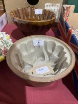 Two salt glazed stoneware jelly moulds.