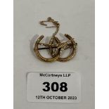 A 9ct double horseshoe brooch. 3g.