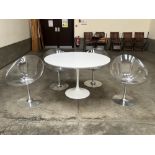 A Italian modernist design dining table with a set of four perspex and steel based chairs.