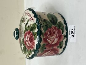 A Wemyss biscuit jar and cover, retailed by T. Goode, London. 4¼" high.