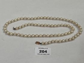 A necklace of knotted pearls with 9ct clasp. 29" long.