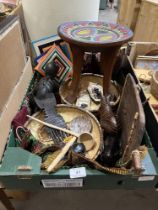 A box of African ethnic objects.