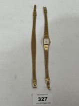 An Avia quartz lady's wristwatch with matching plated bracelet.