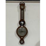 A 19th century mahogany mercurial wheel barometer with silvered dial, level hygrometer and