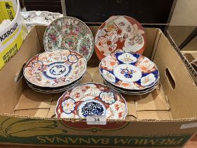 Eight Imari plates and a Chinese famille-rose plate