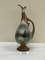 A Royal Worcester ewer, gilded and painted with a seascape to each side by Raymond Rushton. Shape