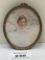 A 19th century portrait miniature of a young lady. Signed Paul de Guise. The gilt reeded frame.