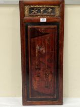 A Chinese wood panel, decorated with a figure scene. 28" x 11".