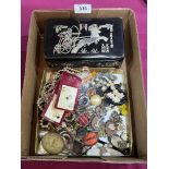 A collection of vintage jewellery with a leather jewellery box.