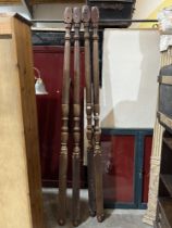 A set of four mahogany bed posts.