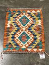 A Chobi Kilim small rug. 0.57m x 0.45m.