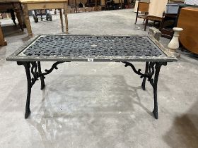 A metal garden table. 45" wide