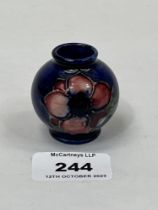 A Moorcroft miniature vase 2" high.