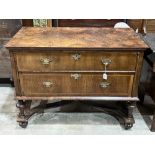 An antique Queen Anne style walnut chest, the line inlaid quarter veneered top over two long drawers