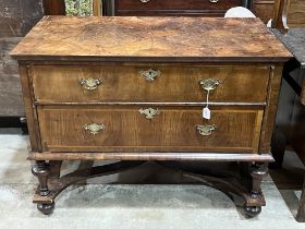 An antique Queen Anne style walnut chest, the line inlaid quarter veneered top over two long drawers