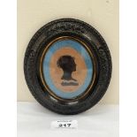 A 19th century portrait silhouette. Moulded oval frame. 6" high.