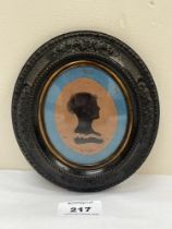 A 19th century portrait silhouette. Moulded oval frame. 6" high.