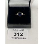 A seven stone sapphire and diamond ring. In gold marked 375. 2g gross.