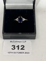A seven stone sapphire and diamond ring. In gold marked 375. 2g gross.