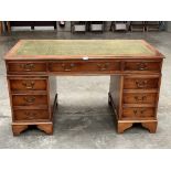A yew wood veneered pedestal desk with inlet leather top. Of recent manufacture. 54" wide.