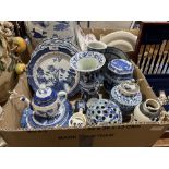 A box of blue and white ceramics