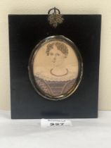 A 19th century portrait miniature of a lady with ringlet hair. The ebonised frame 5¼" high.