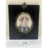 A 19th century portrait miniature of a lady wearing a bonnet. The ebonised frame 5¼" high.