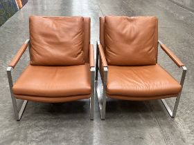 A pair of Camerich of London contemporary style tan leather and steel armchairs.