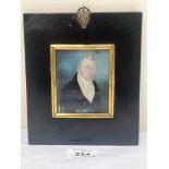 A 19th century portrait miniature of a gentleman in a black jacket and white stock. The ebonised