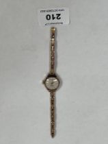 A 9ct ladys's wristwatch with 9ct expanding bracelet. Gold weight 8g gross.