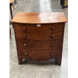 A 19th century mahogany commode in the form of a bow fronted chest. 26" wide.