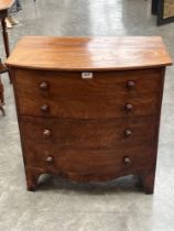 A 19th century mahogany commode in the form of a bow fronted chest. 26" wide.