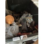 A box of tools and metalware.