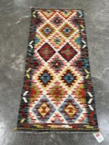 A Chobi Kilim runner. 1.5m x 0.64m