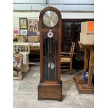 A 1930s oak longcase clock, the two train weight driven movement striking and chiming on 8 tubular