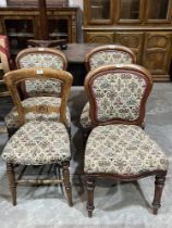 A set of three Victorian dining chairs and another chair.