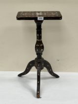 A 19th century Indian table or stand, with foliate mother-of-pearl inlay on tripod support. 22½"