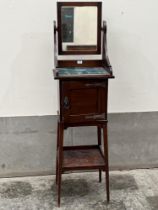 A Victorian mahogany Arts and Crafts gentleman"s washstand. 63" high.