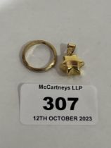 An 18ct ring and a star pendant marked 750. 4g