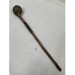 An Asian or African knobkerrie, the shaft with a series of notches. 24½" long.