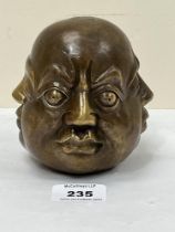 A Chinese bronze four faced buddha head, 4 figure character mark to base. 4½" high.