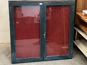 A display case. 37" x 38" x 2½".