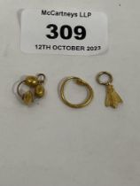Three small items of gold jewellery. 2g.