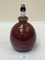 A Ruskin Pottery high fired flambe glaze table lamp. 8" high excluding fitting. Impressed Ruskin