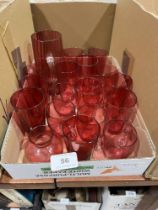 A collection of cranberry and other glassware