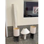 A floor lamp; a pair of stone based table lamps and a ceramic based table lamp. (4)