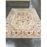 A cream ground wool carpet. 122" x 96"